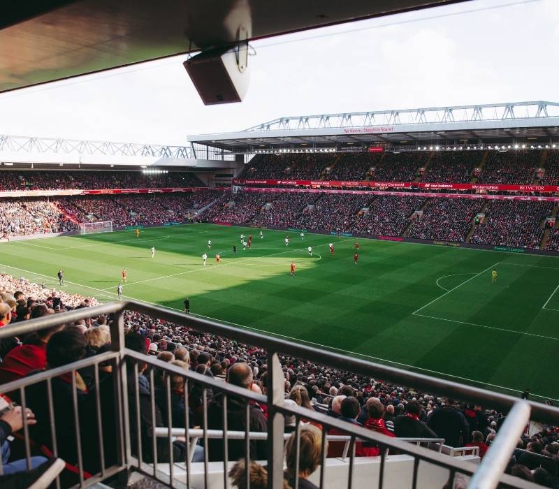 Football fans watching a live match in England