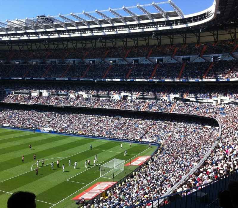 Crowded football stadium during a Premier League match with passionate fans enjoying an unforgettable live soccer experience in England