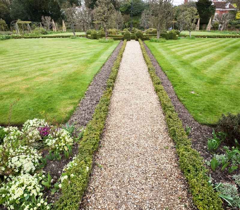 Beautiful garden path surrounded by lush greenery in Hampshire, England