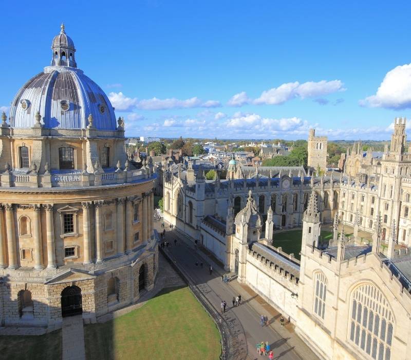 Scenic view of Oxford University architecture with a bright blue sky