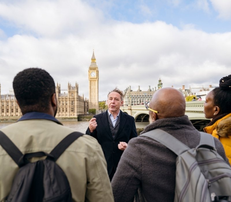 Tourists exploring London landmarks on a guided city tour